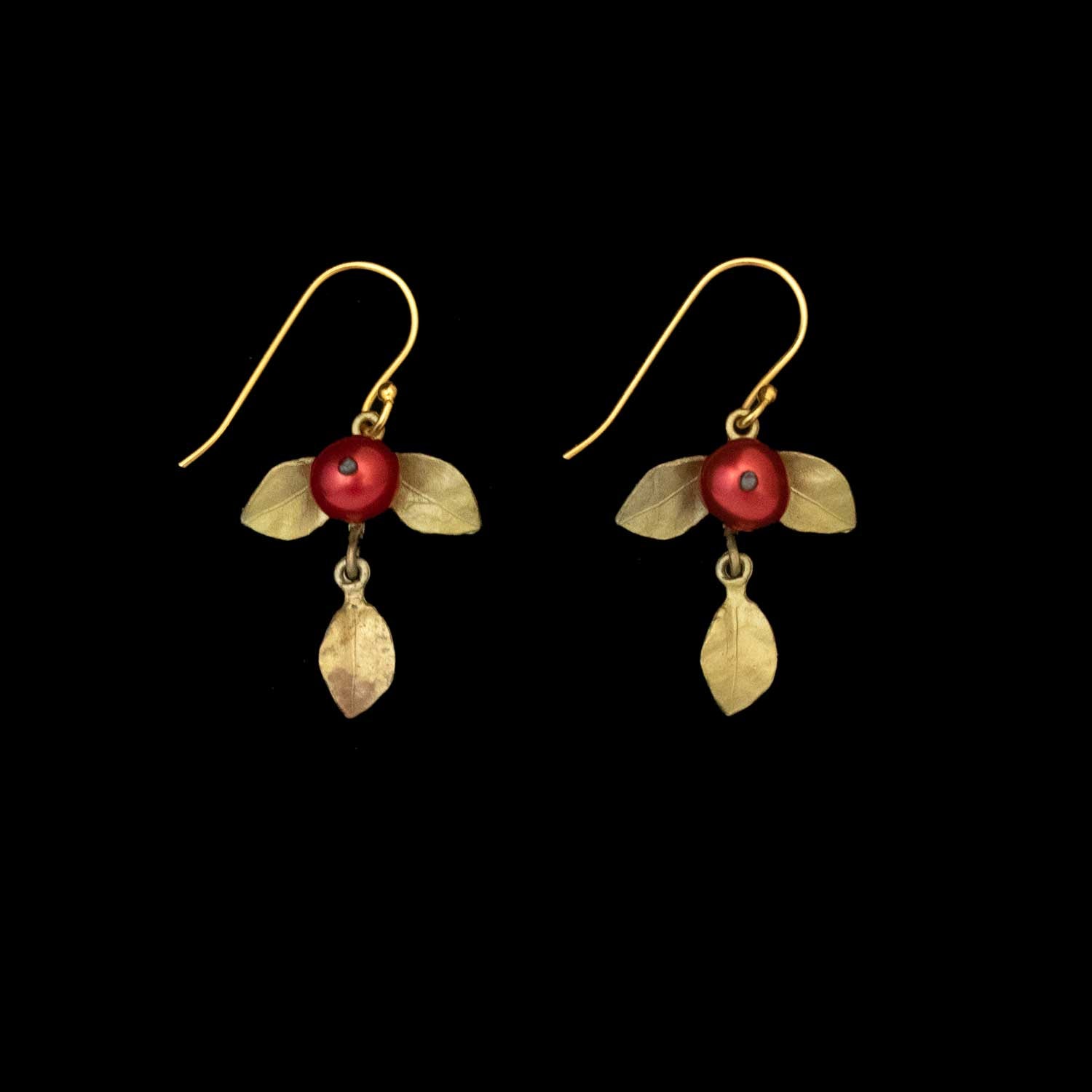 Unroasted Coffee Bean Earrings - Wire: Gold hook earrings with a red pearl at the center, accented by three bronze leaves, shown on a solid black background.